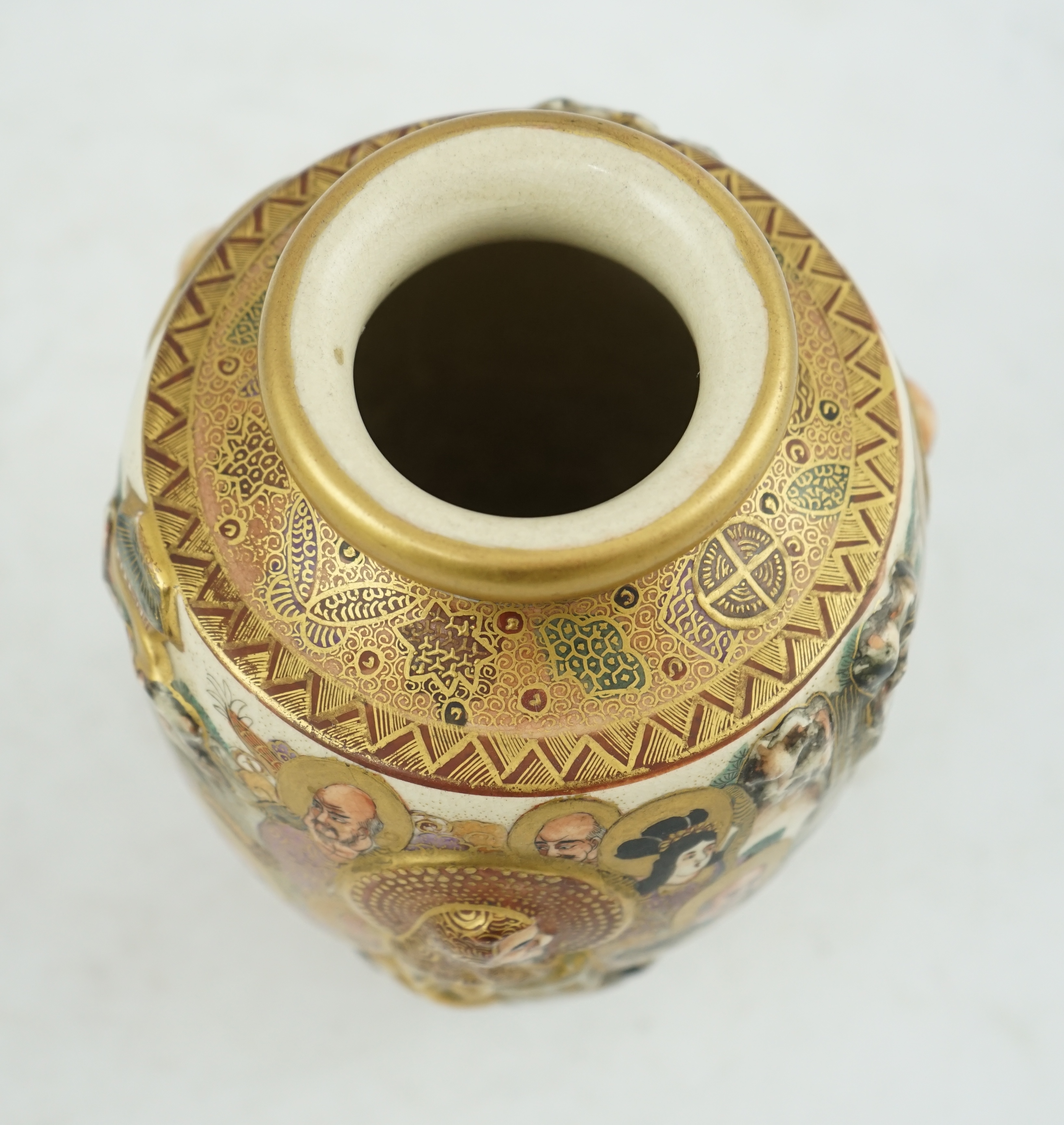 A Japanese Satsuma relief moulded ‘rakan’ vase, Meiji period